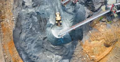 Mining site with trucks and machinery